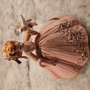 Original Josef lady with bird.